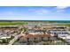 Aerial view of waterfront condo community with airport across the street at 235 Base E Ave # 207, Venice, FL 34285