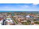 Expansive aerial view showcasing the beautiful city, coastline, and clear blue skies at 235 Base E Ave # 207, Venice, FL 34285