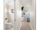 Hallway leading to the primary bedroom and bathroom. Includes bathroom access at 235 Base E Ave # 207, Venice, FL 34285
