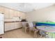 A well-lit living room with cabinets, a sink, and ample space for dining and relaxation at 235 Base E Ave # 207, Venice, FL 34285