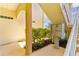 Convenient mailboxes located near building stairwell surrounded by manicured landscaping at 235 Base E Ave # 207, Venice, FL 34285