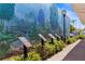 Scenic mural enhances this walkway with greenery, informational plaques, and a serene ambiance at 235 Base E Ave # 207, Venice, FL 34285