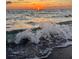 Picturesque ocean view capturing the sunset over gently crashing waves at 235 Base E Ave # 207, Venice, FL 34285