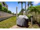 A well-maintained outdoor grill on a sunny lawn, perfect for summer barbecues at 235 Base E Ave # 207, Venice, FL 34285