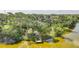 Aerial shot showcases a house with a dock, waterfront access and lush greenery in a serene setting at 249 Hallcrest Ter, Port Charlotte, FL 33954