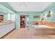 Bright bathroom features a soaking tub, dual sinks, and stylish tile flooring at 249 Hallcrest Ter, Port Charlotte, FL 33954