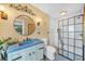 Bathroom with stone countertops and glass shower enclosure at 249 Hallcrest Ter, Port Charlotte, FL 33954
