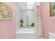 The bathroom has a shower and tub combination and neutral wall paint at 249 Hallcrest Ter, Port Charlotte, FL 33954
