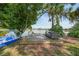 Private backyard dock with a seating area and a boat offers peaceful waterfront relaxation at 249 Hallcrest Ter, Port Charlotte, FL 33954