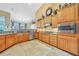 Spacious kitchen featuring wood cabinets, granite countertops, and stainless steel appliances at 249 Hallcrest Ter, Port Charlotte, FL 33954