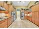 Kitchen with wood cabinets, stainless steel appliances, and tiled floors at 249 Hallcrest Ter, Port Charlotte, FL 33954