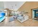 Bright living room with tile floors, high ceilings, and a view to the pool at 249 Hallcrest Ter, Port Charlotte, FL 33954