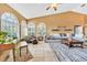 Inviting living room with large windows, comfortable seating, and a cozy atmosphere at 249 Hallcrest Ter, Port Charlotte, FL 33954