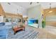 Bright and airy living room with tile floors, high ceilings, and a view to the pool at 249 Hallcrest Ter, Port Charlotte, FL 33954