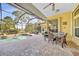 Covered patio with a dining table, pool, and a screened enclosure at 249 Hallcrest Ter, Port Charlotte, FL 33954