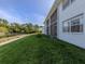 Well-maintained lawn that leads to a lake and condo buildings at 25050 Sandhill Blvd # 6A3, Punta Gorda, FL 33983