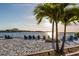 Scenic beach with sandy shore and lounge chairs facing the bay at 25050 Sandhill Blvd # 6A3, Punta Gorda, FL 33983