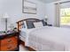 Well-lit bedroom with natural light, a comfy bed, warm decor and stylish bedside tables at 25050 Sandhill Blvd # 6A3, Punta Gorda, FL 33983