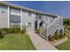 Two-story condo building with well-manicured lawn, shrubbery and easy stair access at 25050 Sandhill Blvd # 6A3, Punta Gorda, FL 33983