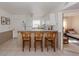 Eat-in kitchen and breakfast bar area with seating and a full view into the bedroom at 25050 Sandhill Blvd # 6A3, Punta Gorda, FL 33983