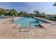 Community pool featuring lounge chairs and shallow entrance steps at 25050 Sandhill Blvd # 6A3, Punta Gorda, FL 33983