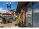 Sidewalk view of restaurant River City Grill with outdoor dining and awning at 25050 Sandhill Blvd # 6A3, Punta Gorda, FL 33983