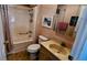 Bathroom featuring a shower/tub combo, toilet, and vanity sink at 310 Tropic Dr, Osprey, FL 34229