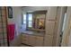 This bathroom provides cabinet storage, a decorative screen and a large mirror at 310 Tropic Dr, Osprey, FL 34229