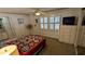 This bedroom has ample storage, shuttered windows and features a colorful quilt at 310 Tropic Dr, Osprey, FL 34229