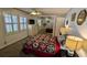 This bedroom offers storage, shuttered windows and a closet mirror making the room feel more spacious at 310 Tropic Dr, Osprey, FL 34229