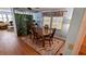 Cozy dining area with warm wood table and a patterned rug, perfect for Gathering gatherings at 310 Tropic Dr, Osprey, FL 34229