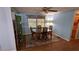 Traditional dining space featuring wood table, area rug, and a view to the cozy living space at 310 Tropic Dr, Osprey, FL 34229