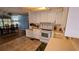 Cozy kitchen with white cabinetry, tile floors, and eat in dining room at 310 Tropic Dr, Osprey, FL 34229