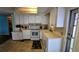 Functional kitchen featuring white cabinets and essential appliances at 310 Tropic Dr, Osprey, FL 34229