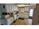 Well-lit kitchen boasts ample counter space, storage, and convenient layout at 310 Tropic Dr, Osprey, FL 34229