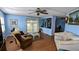 This comfortable living room provides slider access to the outdoor patio with adjacent dining space at 310 Tropic Dr, Osprey, FL 34229