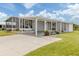Lovely single-story home with a screened-in porch, covered parking, and beautifully maintained landscaping at 349 Mariner Dr, North Port, FL 34287