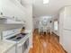 Open kitchen design featuring wood flooring connects seamlessly to the dining area and surrounding living spaces at 349 Mariner Dr, North Port, FL 34287