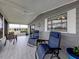 Inviting lanai featuring lounge chairs and a table, perfect for enjoying the outdoors at 349 Mariner Dr, North Port, FL 34287