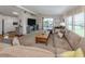Open-concept living room featuring a sliding glass door, connecting to the outdoors, and neutral colors at 349 Mariner Dr, North Port, FL 34287