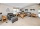 Comfortable living room featuring cozy seating, natural light, and neutral colors at 349 Mariner Dr, North Port, FL 34287