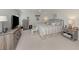 Relaxing main bedroom with carpet flooring, a ceiling fan, two dressers, and neutral decor, creating a serene space at 349 Mariner Dr, North Port, FL 34287