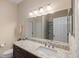 Bathroom featuring a wide mirror, vanity with drawers, and modern fixtures at 3613 Parkridge Cir # 11-201, Sarasota, FL 34243