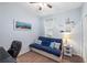 Cozy bedroom featuring a sleeper sofa, nautical themed decor and a well-lit window at 3613 Parkridge Cir # 11-201, Sarasota, FL 34243