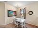 Well-lit dining area showcasing a chandelier and plenty of natural light at 3613 Parkridge Cir # 11-201, Sarasota, FL 34243