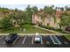 Well maintained townhome building with lush green lawns and assigned parking spaces, including handicap accessible at 3613 Parkridge Cir # 11-201, Sarasota, FL 34243