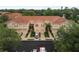 Beautiful townhomes with orange tile roofs, garages, and manicured landscaping in a well-maintained community at 3613 Parkridge Cir # 11-201, Sarasota, FL 34243