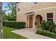 Inviting townhouse exterior featuring a well-maintained front yard and charming front door at 3613 Parkridge Cir # 11-201, Sarasota, FL 34243