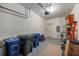 Cluttered two car garage providing ample storage space at 3613 Parkridge Cir # 11-201, Sarasota, FL 34243