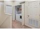 Convenient laundry room with a washer, dryer, and shelving for storage and organization at 3613 Parkridge Cir # 11-201, Sarasota, FL 34243